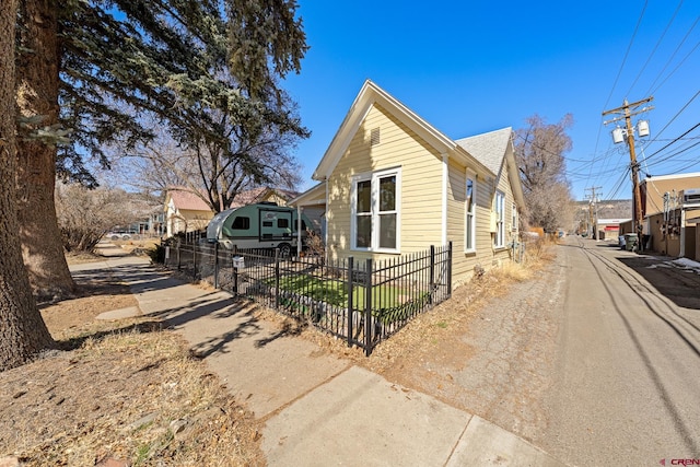 view of side of property with a fenced front yard