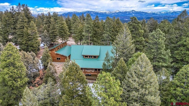 bird's eye view featuring a mountain view and a view of trees