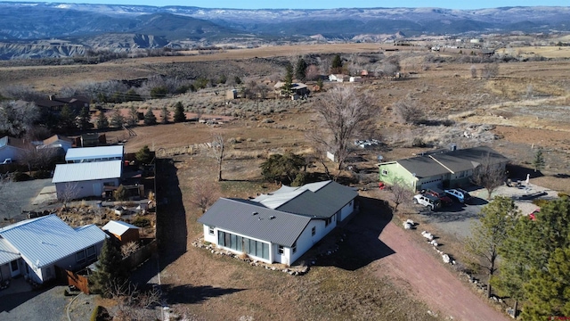 drone / aerial view featuring a mountain view