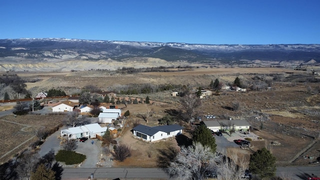 birds eye view of property with a mountain view