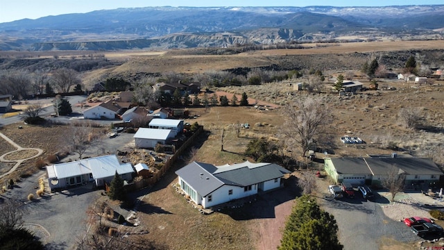 birds eye view of property with a mountain view