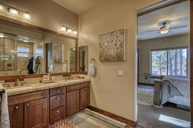 bathroom with a wealth of natural light, a sink, and ensuite bathroom