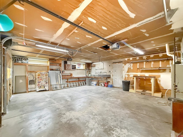 garage featuring a workshop area and a garage door opener