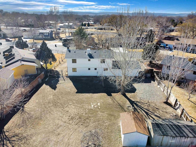 birds eye view of property with a residential view