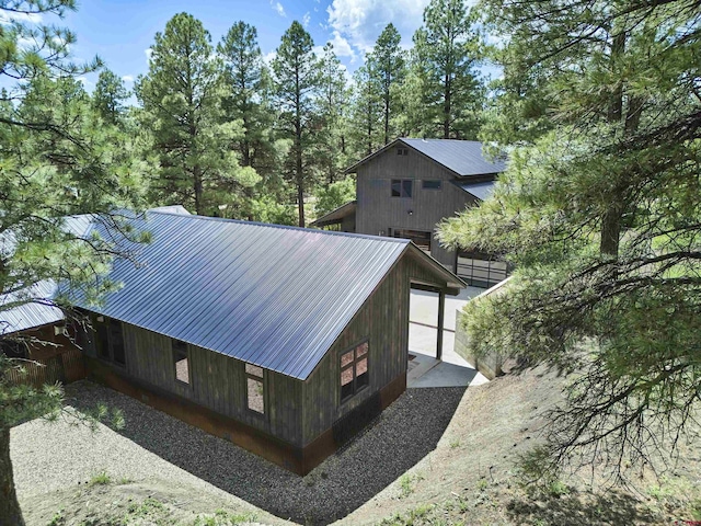 view of side of home featuring metal roof