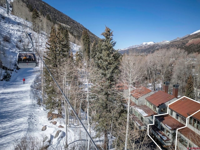 exterior space featuring a forest view and a mountain view