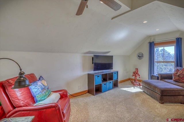 living room with carpet floors, vaulted ceiling, a textured ceiling, and baseboards