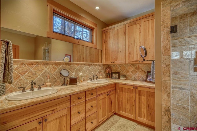 kitchen with decorative backsplash, a sink, and light countertops