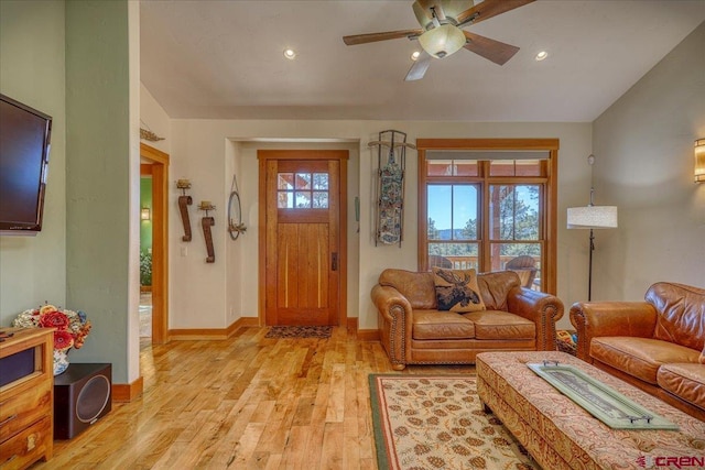 entrance foyer featuring baseboards, lofted ceiling, light wood-style flooring, ceiling fan, and recessed lighting