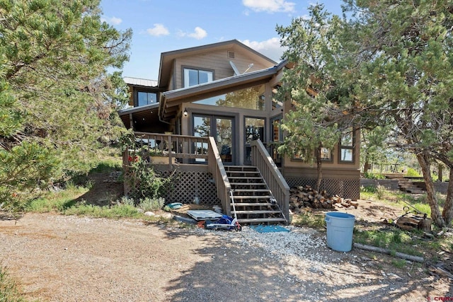 exterior space featuring stairway and a deck