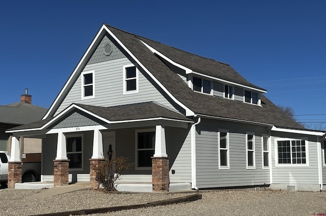 view of front of home with a porch, crawl space, and a shingled roof