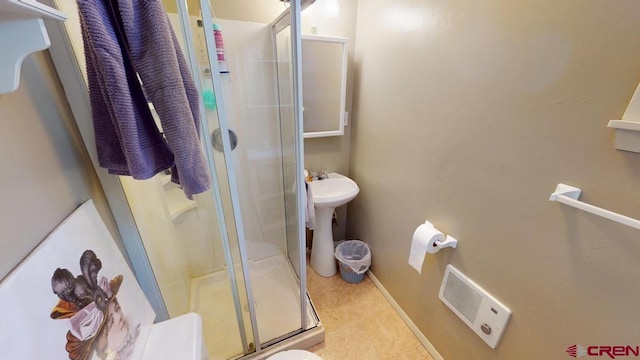 full bathroom featuring a sink, tile patterned flooring, a shower stall, and visible vents