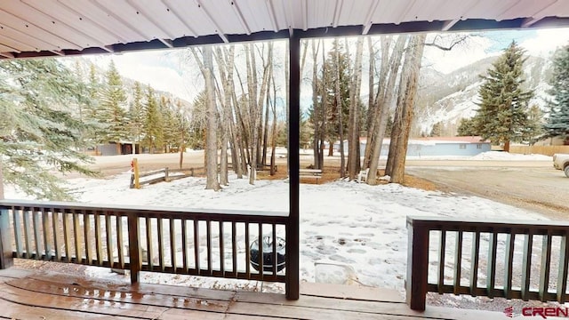 view of snow covered deck