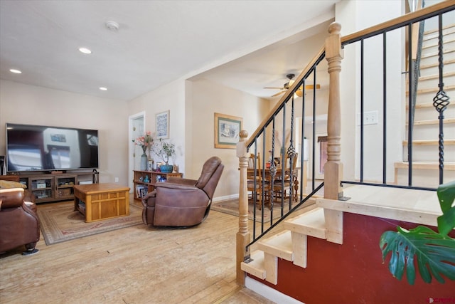 living room featuring recessed lighting, wood finished floors, a ceiling fan, baseboards, and stairway