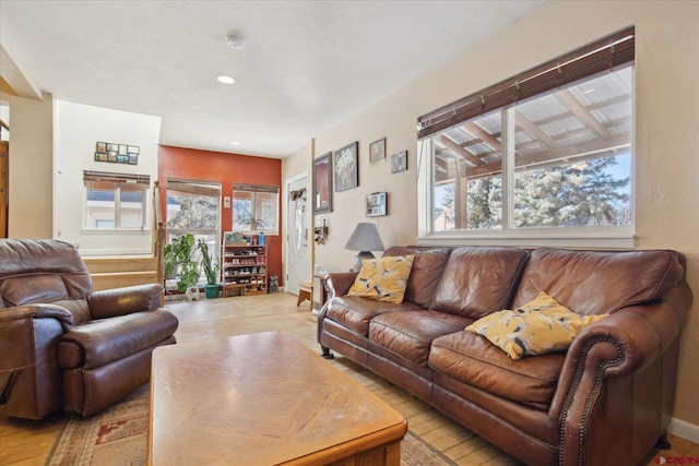 living room with a healthy amount of sunlight and light wood finished floors