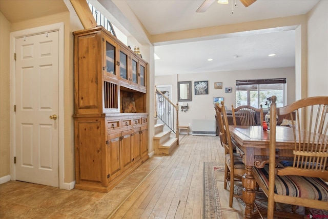 dining space featuring recessed lighting, light wood-style flooring, stairway, ceiling fan, and baseboards