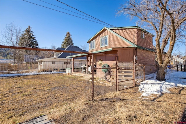 view of front of house with fence