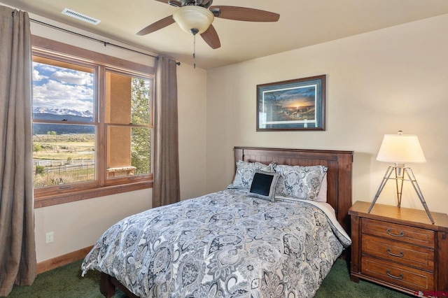 bedroom featuring carpet flooring, a ceiling fan, baseboards, and visible vents