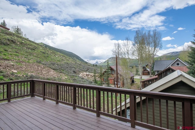 wooden deck featuring a mountain view