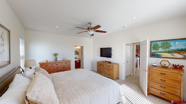 bedroom featuring light carpet, ensuite bath, ceiling fan, and recessed lighting