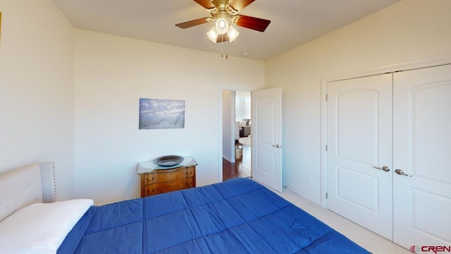 bedroom with ceiling fan and a closet