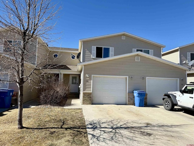 traditional-style home with driveway and an attached garage