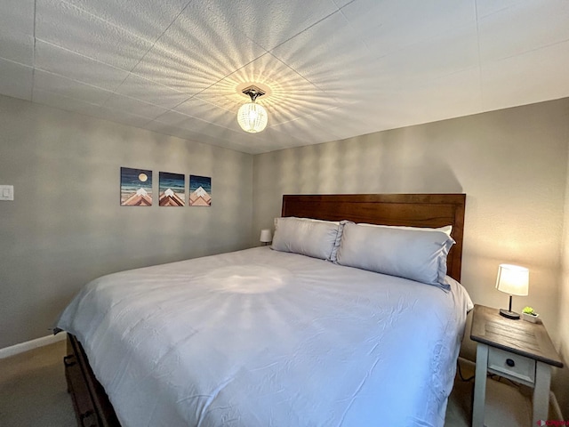 bedroom with carpet and baseboards