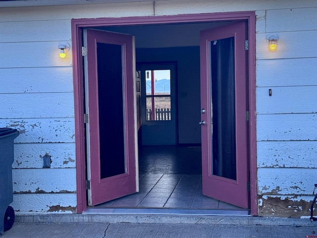 entrance to property with brick siding