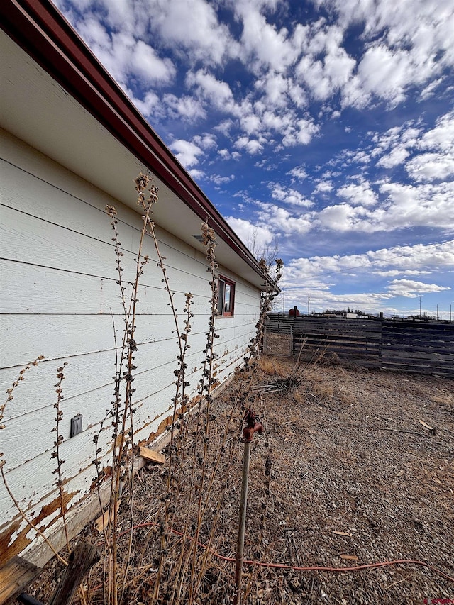 view of side of property with fence