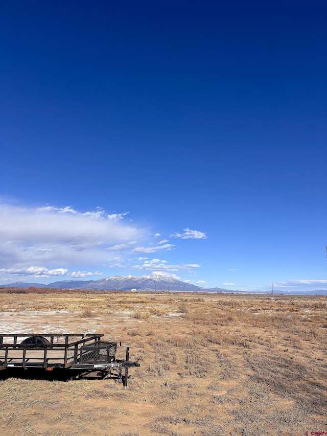 view of mountain feature with a rural view