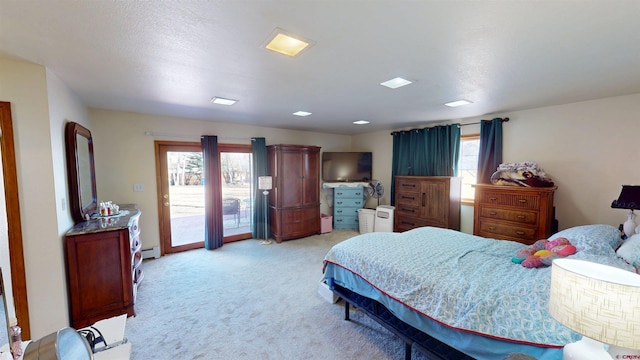 bedroom featuring light carpet, access to outside, and baseboard heating