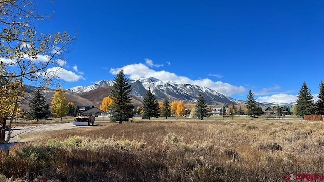 mountain view featuring a rural view