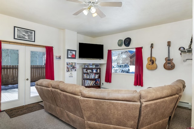 carpeted living area featuring a baseboard radiator, french doors, a healthy amount of sunlight, and ceiling fan