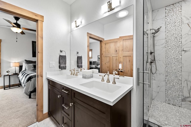 full bathroom featuring a marble finish shower, a sink, ensuite bath, and double vanity