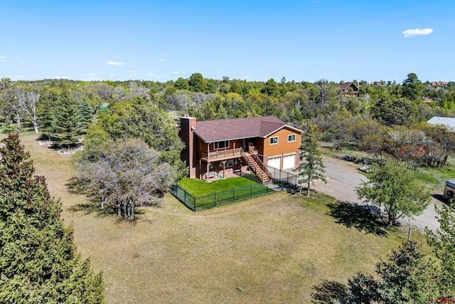 aerial view featuring a wooded view