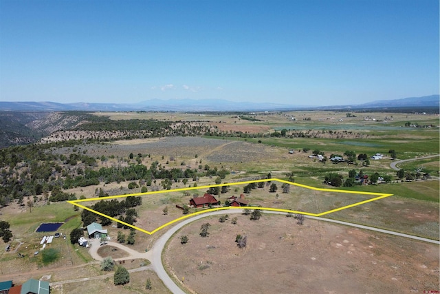 aerial view featuring a rural view and a mountain view