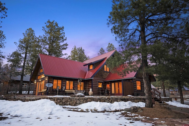 view of front of house featuring covered porch and metal roof