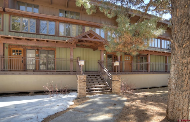 view of front of home with stairs