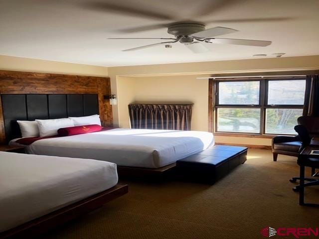 carpeted bedroom featuring a ceiling fan