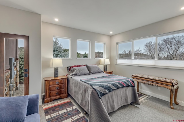 bedroom featuring recessed lighting and baseboards