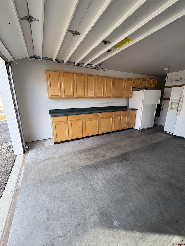 garage featuring freestanding refrigerator