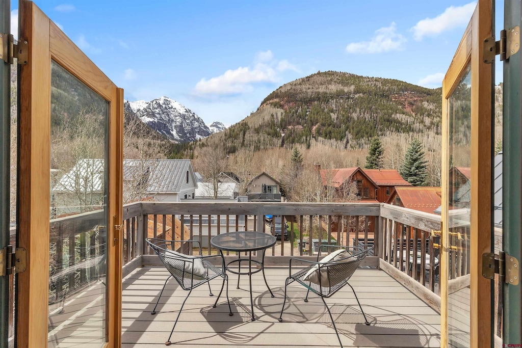 wooden terrace with a mountain view