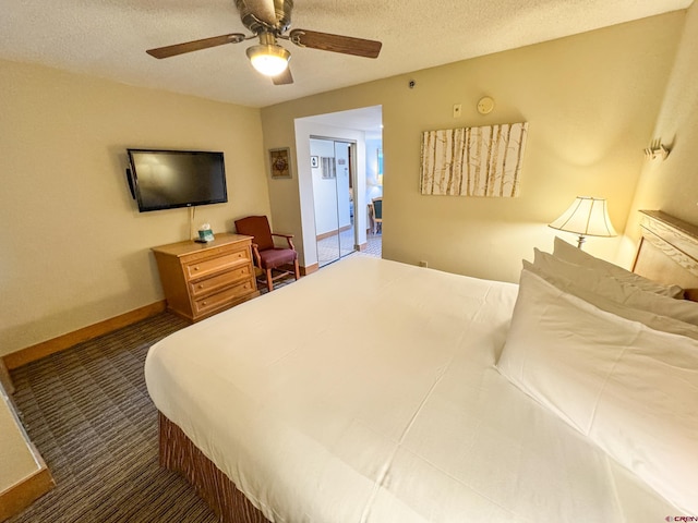 bedroom featuring a textured ceiling, carpet floors, a ceiling fan, and baseboards