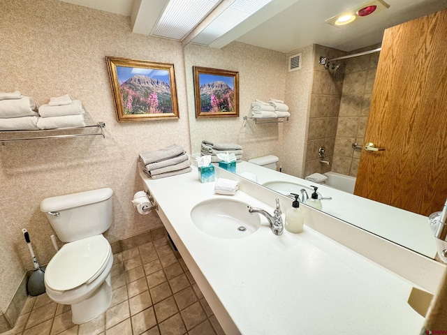 full bath with visible vents, toilet, vanity,  shower combination, and tile patterned floors