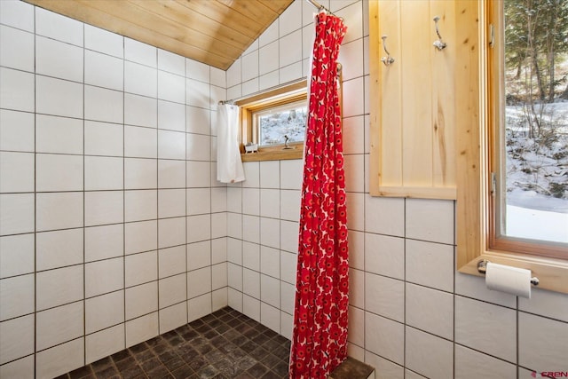 bathroom featuring lofted ceiling