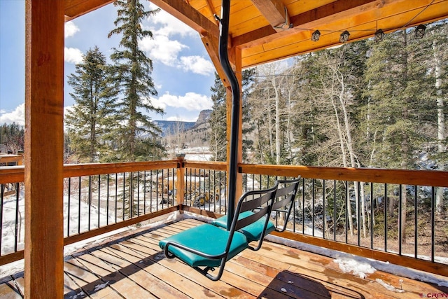 wooden terrace featuring a mountain view