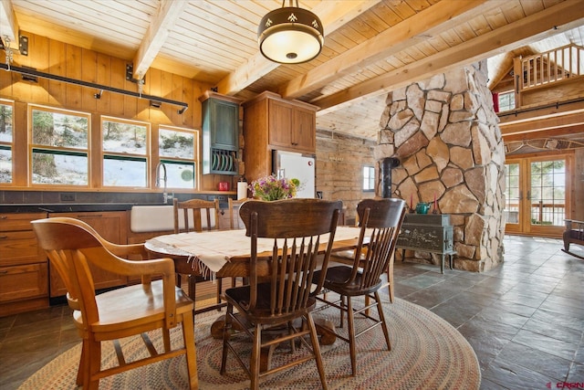 dining area with vaulted ceiling with beams, french doors, and wood ceiling