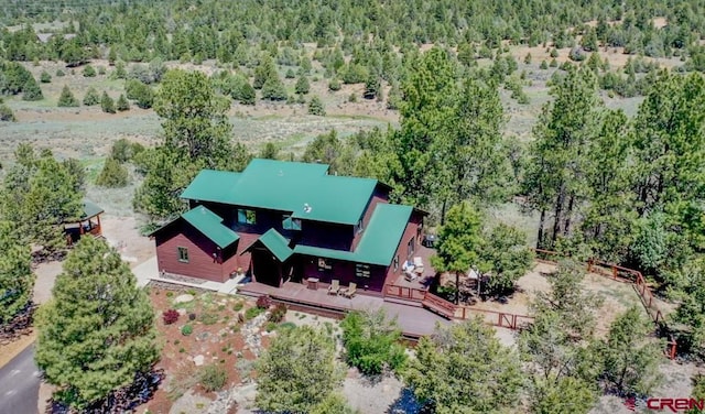 bird's eye view featuring a forest view