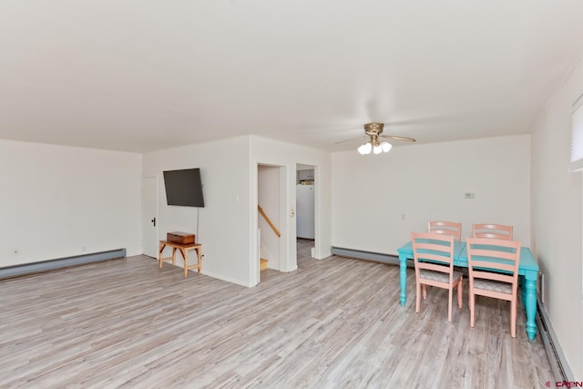 game room with a baseboard heating unit, ceiling fan, and light wood-style floors