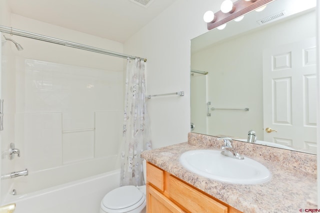 full bathroom featuring toilet, vanity, visible vents, and shower / bathtub combination with curtain